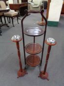 An Edwardian folding cake stand and two smoker's stands