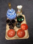 A tray of Oriental wares, blue and white table lamp, famille rose vase,