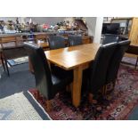 A contemporary oak extending dining table,