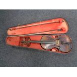 An antique violin and bow in coffin case CONDITION REPORT: 14 inch back length.