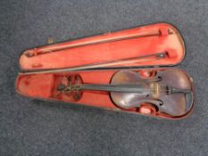 An antique violin and bow in coffin case CONDITION REPORT: 14 inch back length.