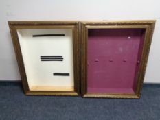 A pair of gilt framed wall mounted display boards