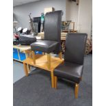 A beech coffee table together with a pair of leather chairs