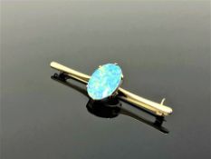 A yellow gold opal bar brooch