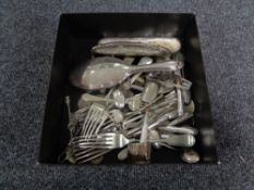 A box of silver plated cutlery, coins, two silver brush backs,