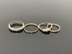 An 18ct gold band ring (broken),