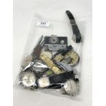 A bag of various wristwatches, pens,