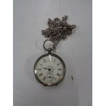 A silver fob watch on chain