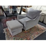 A contemporary armchair with storage footstool CONDITION REPORT: This is suede,