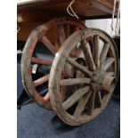 Two wooden cart wheels