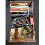 A box of Hornby railways track, accessories, annuals including A-team, air wolf,