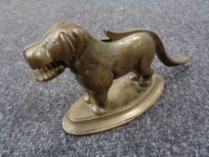 A 1930's brass nut cracker in the form of a dog