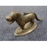 A 1930's brass nut cracker in the form of a dog