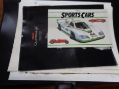 Two artist cases containing 1996 pirelli calendar, sportscar book,