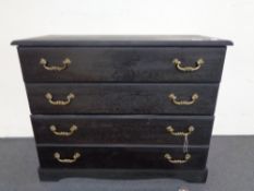 An antique style four drawer chest