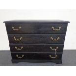 An antique style four drawer chest