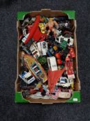 A box of mid century die cast vehicles, He-Man figure,