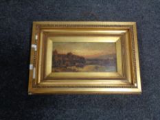 An antique gilt framed oil on board- rowing boat on lake with castle beyond signed Mctear