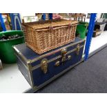A metal bound trunk together with a wicker Fortnum and Mason hamper
