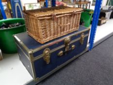 A metal bound trunk together with a wicker Fortnum and Mason hamper