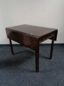 An early 19th century mahogany Pembroke table