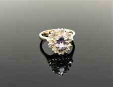 A 14ct gold tanzanite and diamond ring,