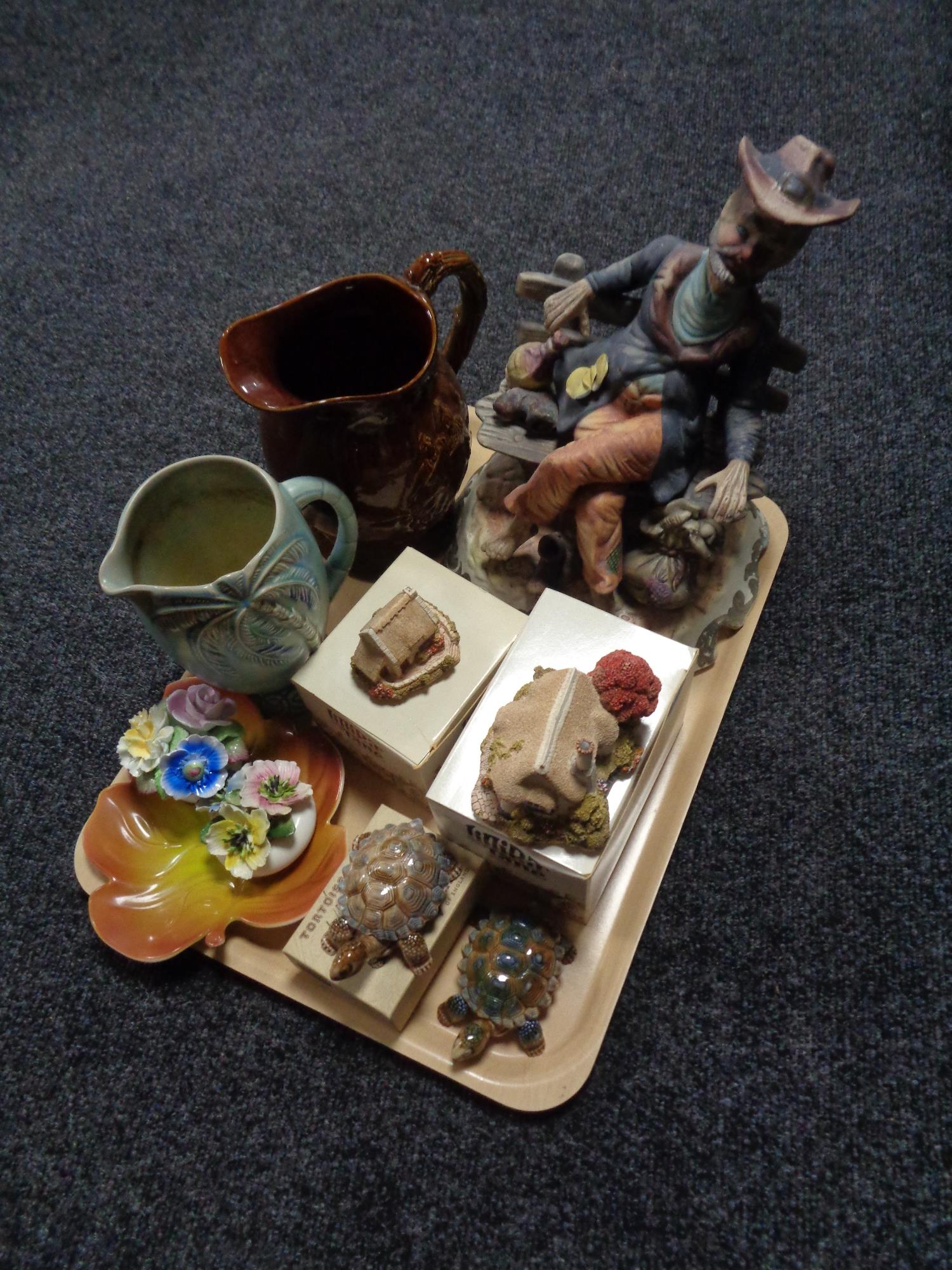 A tray of Italian figure of a tramp, musical pottery jug,