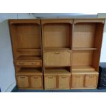 A multi section teak effect wall unit