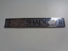 A Silver Shadow II car badge