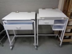 Two metal medical trolleys fitted with drawers