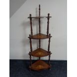 A Victorian inlaid mahogany four tier what not stand