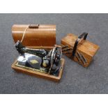 An oak cased vintage sewing machine together with a concertina sewing box CONDITION