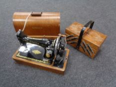 An oak cased vintage sewing machine together with a concertina sewing box CONDITION