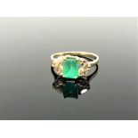 A fine quality 18ct gold emerald and marquise diamond ring,