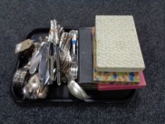 A tray of boxed and unboxed silver plated cutlery