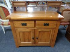 A contemporary oak sideboard fitted two drawers