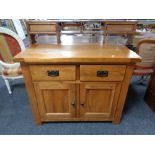 A contemporary oak sideboard fitted two drawers