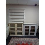 Two early 20th century painted glazed door kitchen cabinets together with a painted pine plate rack