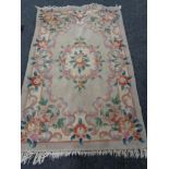 A fringed Chinese floral rug ,