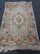 A fringed Chinese floral rug ,