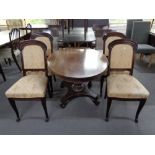 An antique oval occasional table and four 19th century mahogany dining chairs.