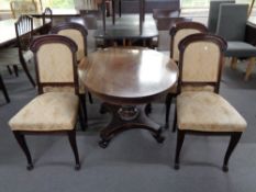 An antique oval occasional table and four 19th century mahogany dining chairs.