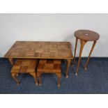 A mid century teak coffee table together with pair of lamp tables and plant stand