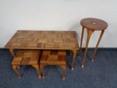 A mid century teak coffee table together with pair of lamp tables and plant stand