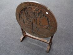A carved oriental hardwood folding occasional table