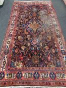 A Hamadan rug, 316cm by 163cm, a/f CONDITION REPORT: Numerous patches moth-damaged.
