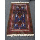 An Afghan prayer rug, 158cm by 93cm,