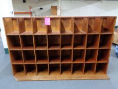 A 20th century haberdashery pigeon hole cabinet with thirty two compartments 217 cm width,