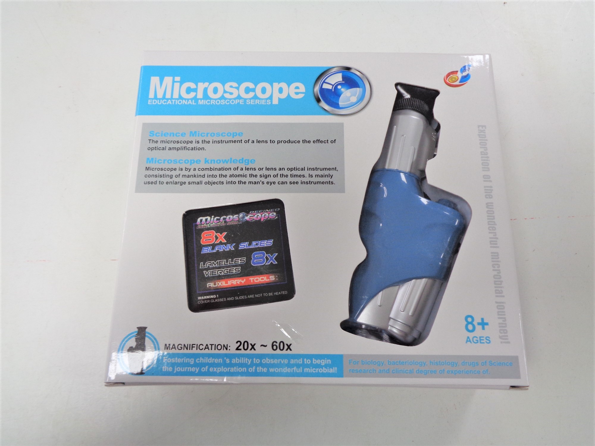Four boxes of 25 educational microscopes