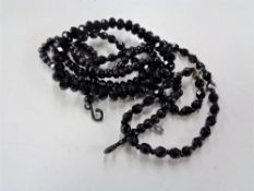 A bag of Whitby Jet bracelet and two necklaces